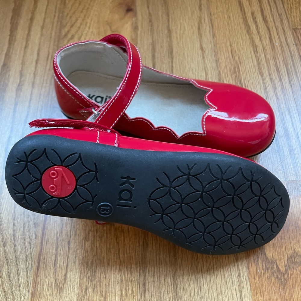 Never worn, See Kai Run patent leather girl’s shoes, size 13.